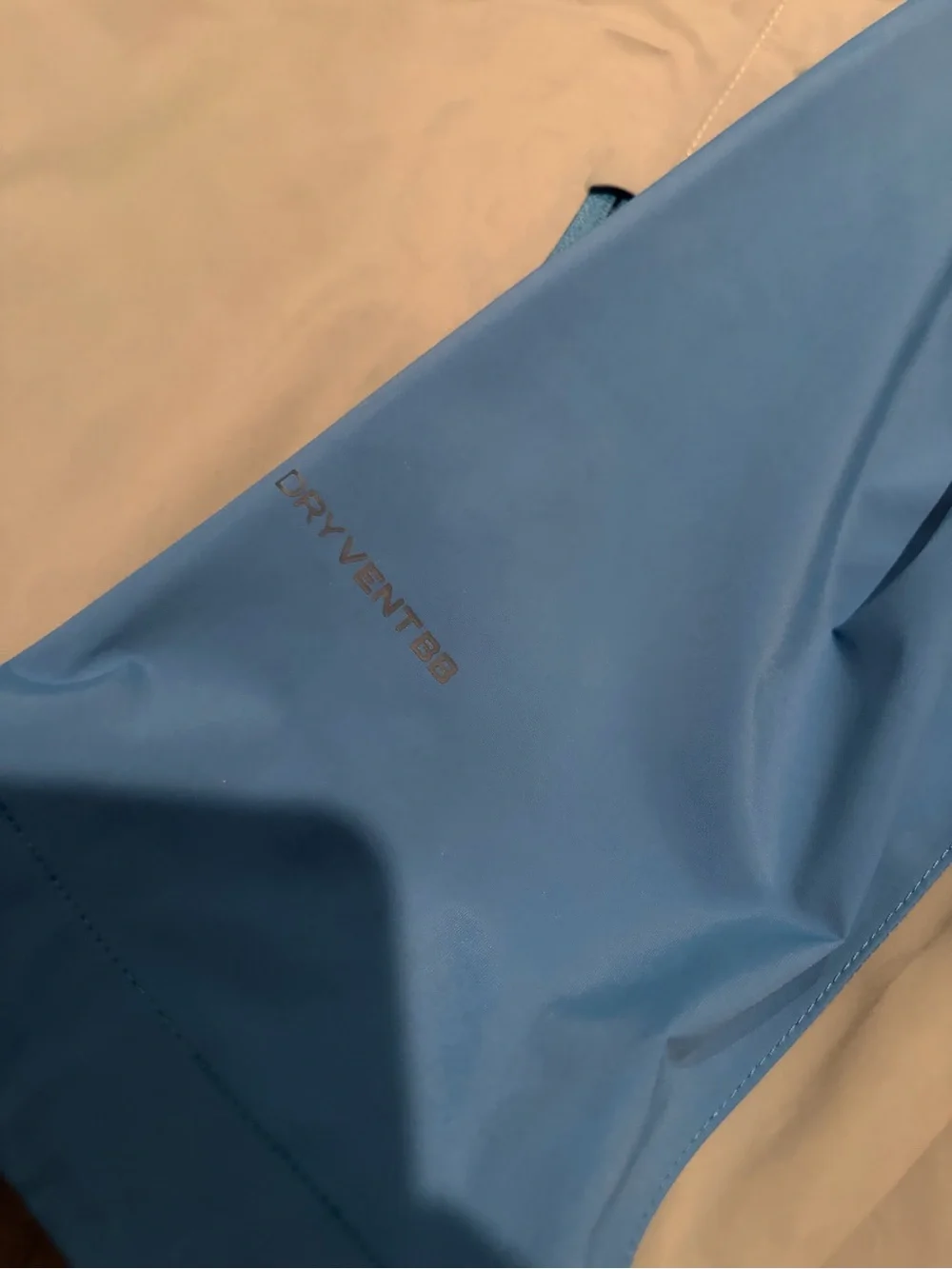The North Face Blue and Gray Hooded Rain Jacket